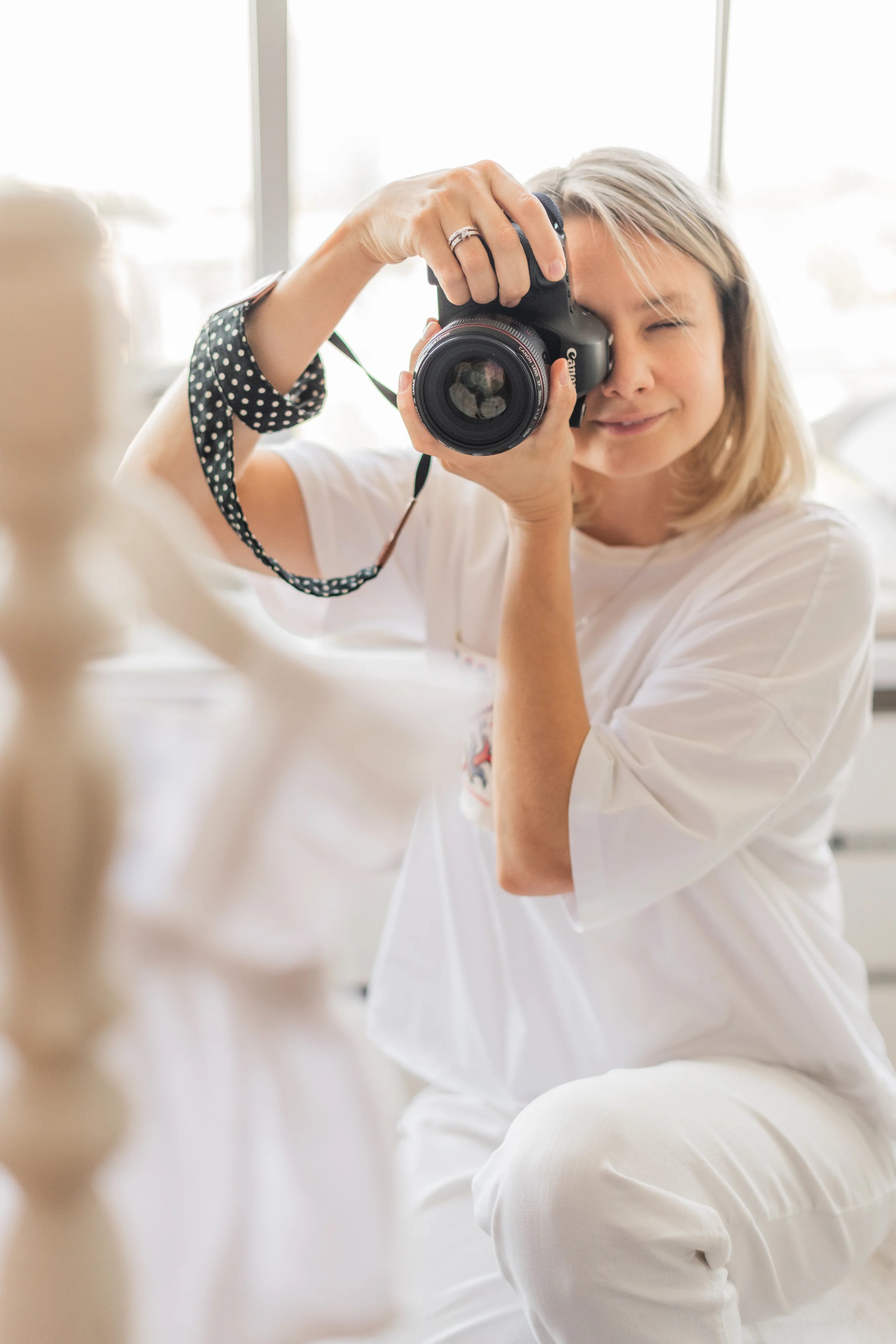Person holding a camera with a blurred background