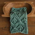 Soft hand-knitted newborn layer with tiny pom-poms — delicate wool prop ideal for baskets, wraps, or layered newborn photography setups.