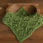 Soft hand-knitted newborn layer with tiny pom-poms — delicate wool prop ideal for baskets, wraps, or layered newborn photography setups.