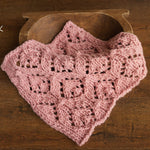 Soft hand-knitted newborn layer with tiny pom-poms — delicate wool prop ideal for baskets, wraps, or layered newborn photography setups.