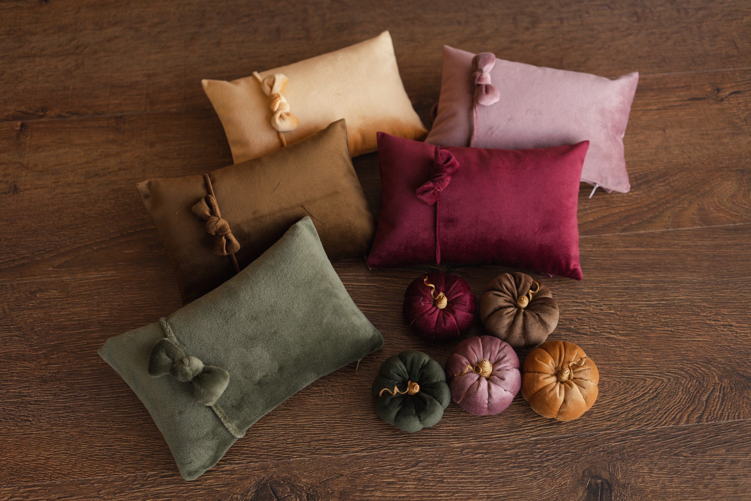 Velvet newborn pumpkin set, styled as a posing pillow and autumn-themed photography prop for newborn sessions