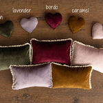Soft velvet newborn photo pillow, used as a posing prop for newborn photography sessions
