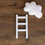 Handcrafted wooden ladder for newborn photo sessions