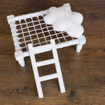 Handcrafted wooden ladder for newborn photo sessions