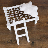 Handcrafted wooden ladder for newborn photo sessions