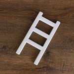 Handcrafted wooden ladder for newborn photo sessions
