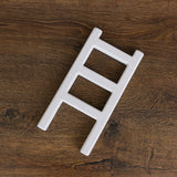 Handcrafted wooden ladder for newborn photo sessions