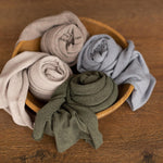 Extra-long melange newborn wrap in soft fabric, styled as a newborn photography prop for posing and photo sessions