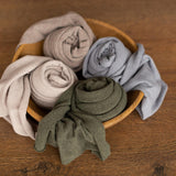 Extra-long melange newborn wrap in soft fabric, styled as a newborn photography prop for posing and photo sessions