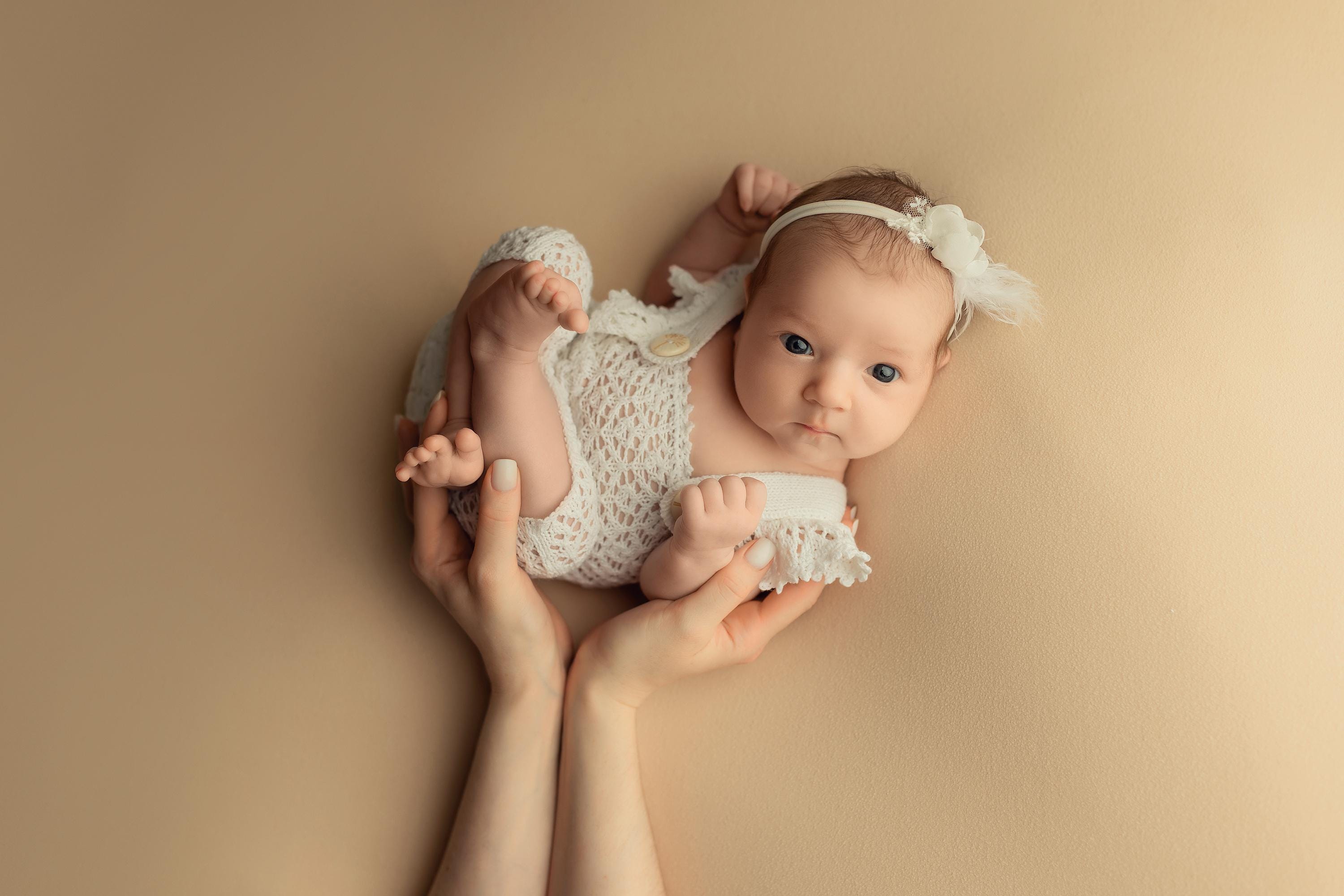 Hand-knitted newborn romper and bonnet set — soft, breathable cotton with delicate ruffle sleeves, perfect for newborn photoshoots, first birthdays, baptisms, or summer outings.