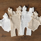 Hand-knitted newborn romper and bonnet set — soft, breathable cotton with delicate ruffle sleeves, perfect for newborn photoshoots, first birthdays, baptisms, or summer outings.